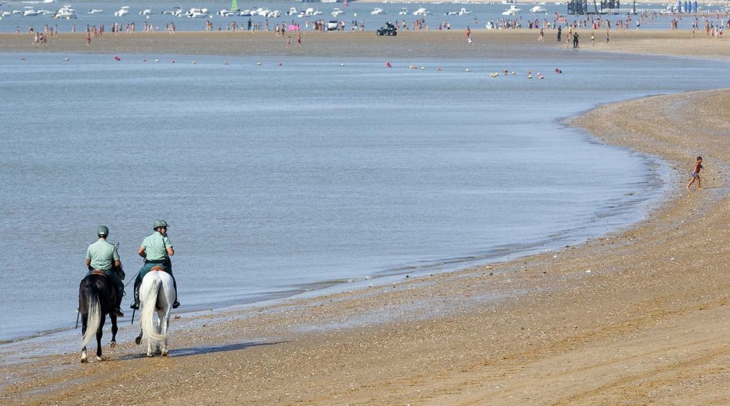 Jockeys race along the beach during the traditional beach race on the Sanlucar de Barrameda's beach in southern Spain, on August 10, 2011. Sanlucar horse racing dates back to 1845 and is some of the oldest in Europe, it currently takes place near the mouth of the Rio Guadalquivir several times during the month of August. (AP Photo/Miguel Gomez)