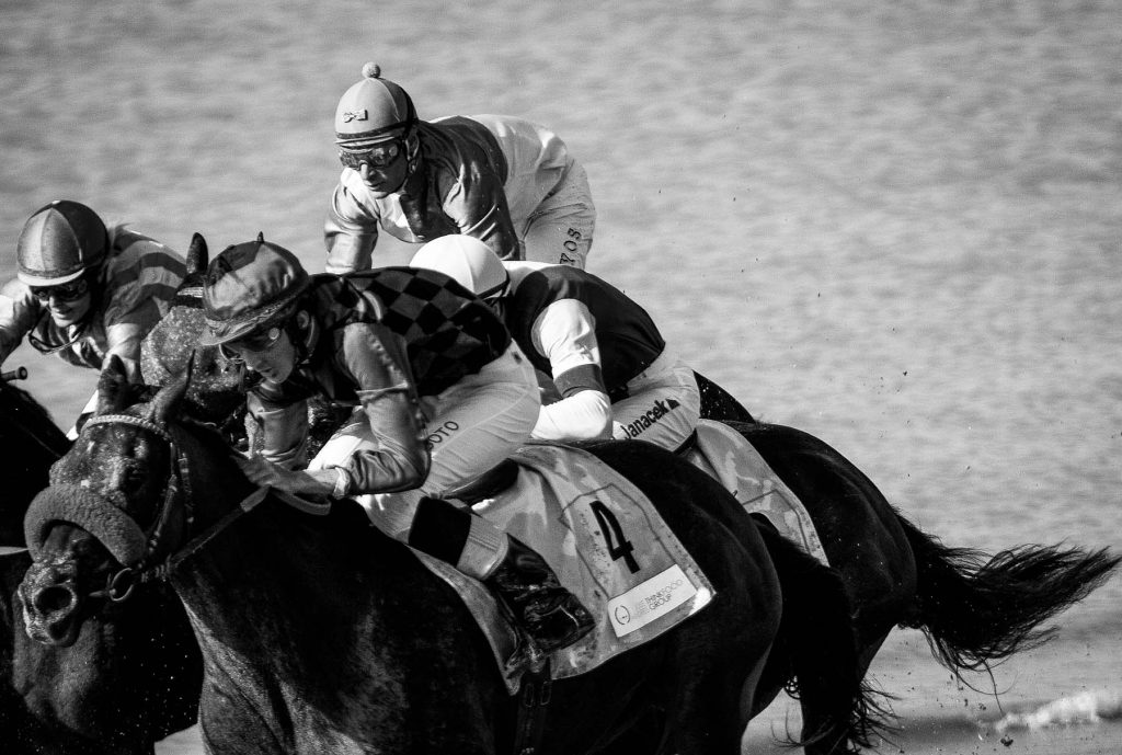 Jockeys race along the beach during the traditional beach race on the Sanlucar de Barrameda's beach in southern Spain, on August 10, 2011. Sanlucar horse racing dates back to 1845 and is some of the oldest in Europe, it currently takes place near the mouth of the Rio Guadalquivir several times during the month of August. (AP Photo/Miguel Gomez)