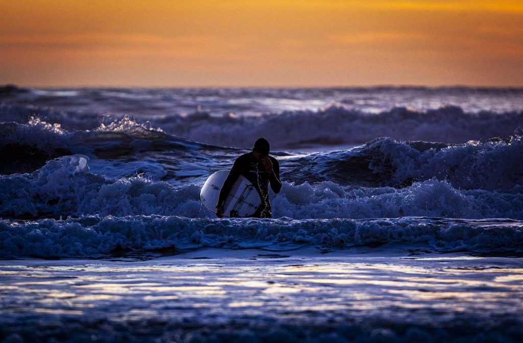 surfer comes out of the water