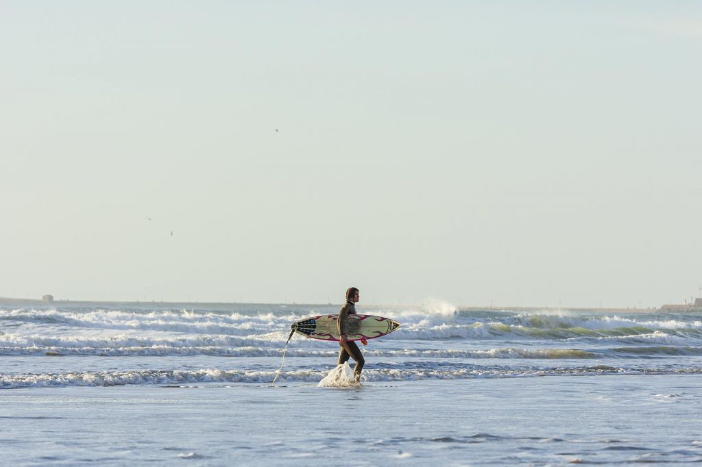 surfer leaving the water